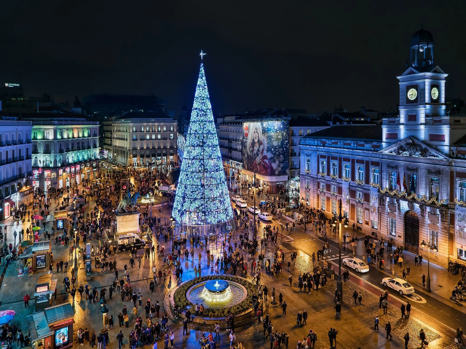 Puerta del Sol at night with Madrid's giant Christmas tree and festive lights